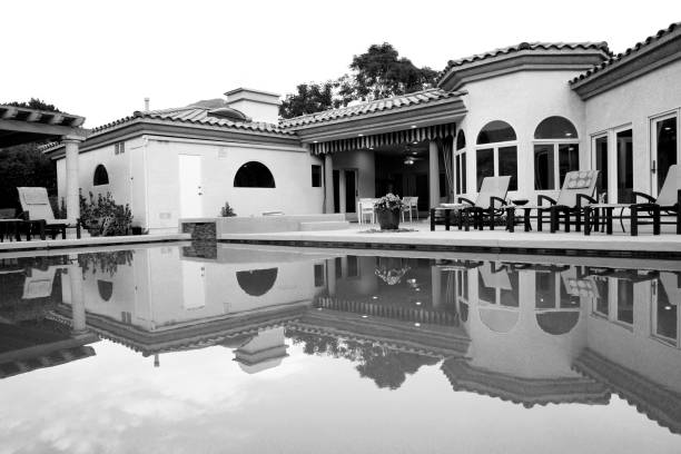 istock Black And White Palm Springs 20th Century Spanish Home Reflected In Pool 1305556467