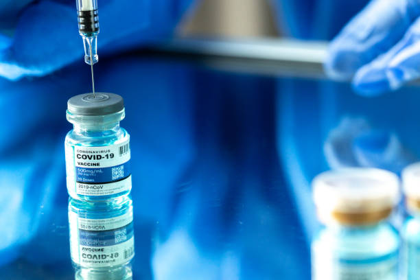 istock Covid vaccine with close up view. 1305558144