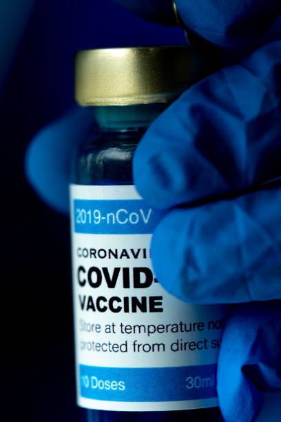 istock Covid vaccine with close up view. 1305558159