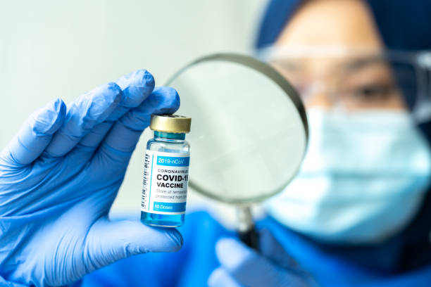 istock Covid vaccine with close up view. 1305560125