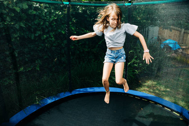 istock Young girl playing in backyard 1305562060