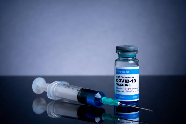istock Covid vaccine bottle with close up view 1305563059