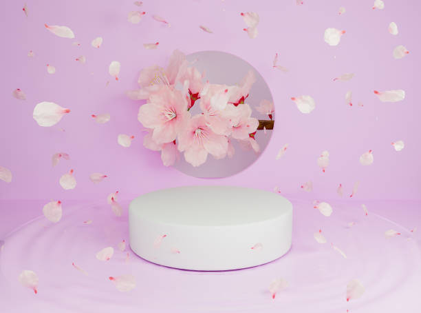 istock cylindrical product stand with falling flower petals 1305563084