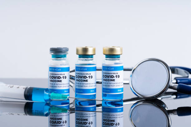 istock Covid vaccine bottle with close up view 1305563106