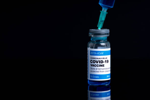 istock Covid vaccine bottle with close up view 1305563147