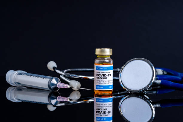 istock Covid vaccine bottle with close up view 1305563148