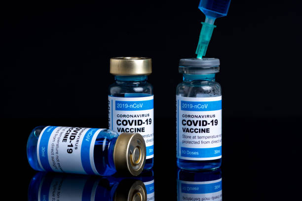 istock Covid vaccine bottle with close up view 1305563149
