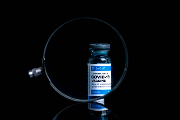 istock Covid vaccine bottle with close up view 1305563151