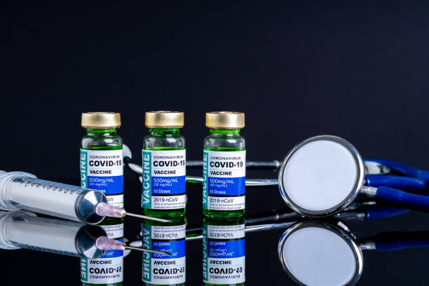 istock Covid vaccine bottle with close up view 1305563157