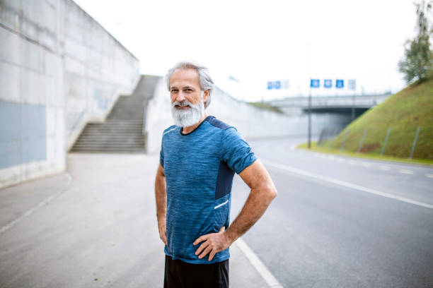 istock Fit Bearded Caucasian Man in Mid 50s With Hands on Hips 1305568062