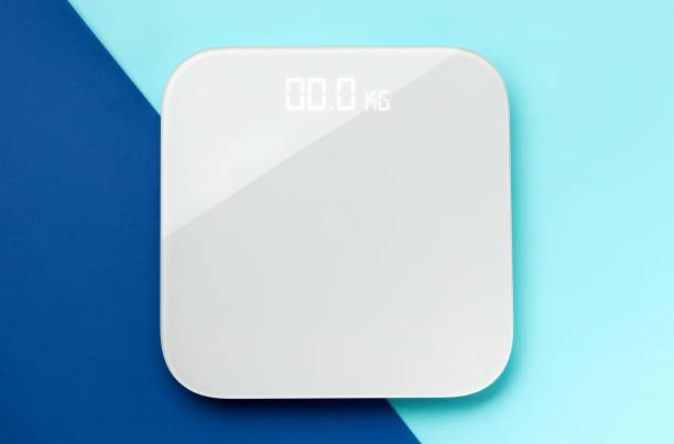 istock Flat lay top view scales onblue double background with copy space 1305573922