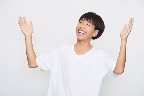 istock Young Asian men are happy and excited on white 1305573972