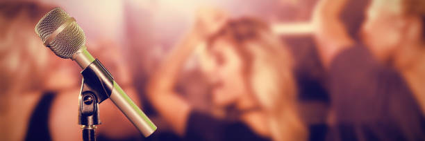 istock Composite image of close-up of microphone 1305577221