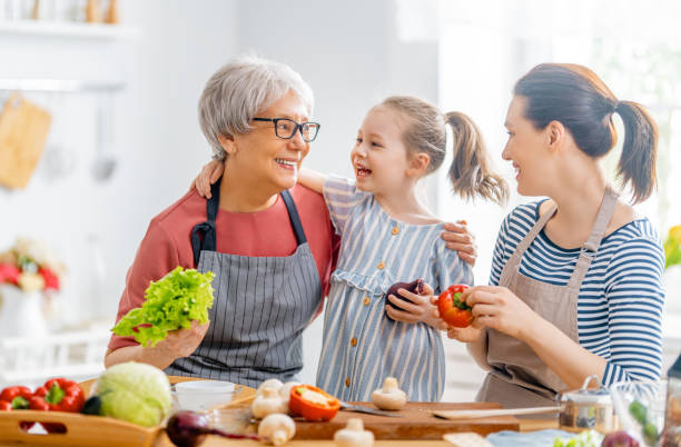 istock Happy family in the kitchen. 1305578479
