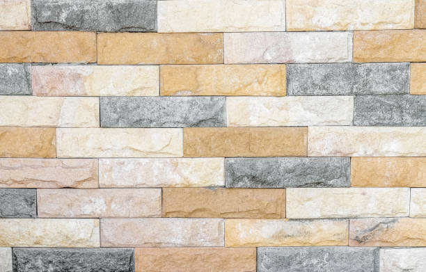 istock Colorful sand stone wall abstract texture for background 1305578617