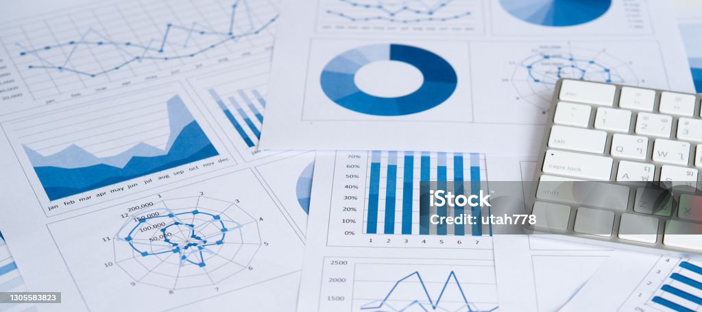 Accounting business Business graphs and charts report with keyboard computer on desk of financial advisor. Financial abstract concepts. Report - Document Stock Photo