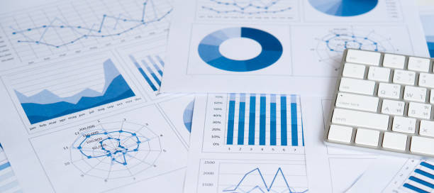 accounting business - tax financial figures analyzing banking document imagens e fotografias de stock