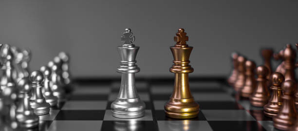 istock Gold Chess figure team (King, Queen, Bishop, Knight, Rook and Pawn) on Chessboard against opponent during battle. Strategy, Success, management, business planning, think, education and leader concept 1305583923