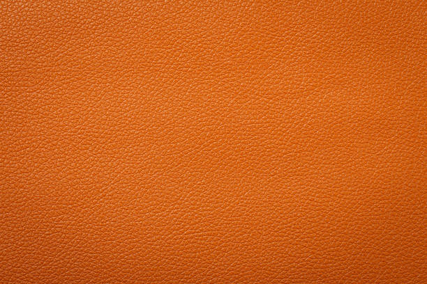 istock Synthetic leather brown background texture. Brown leather textured background. 1305588711