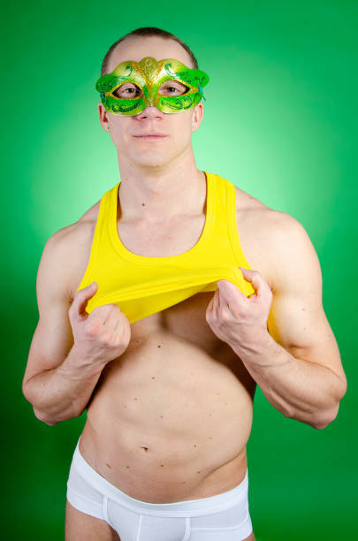 istock Carnival. Holidays and weekends. Young sexy man. 1305590105
