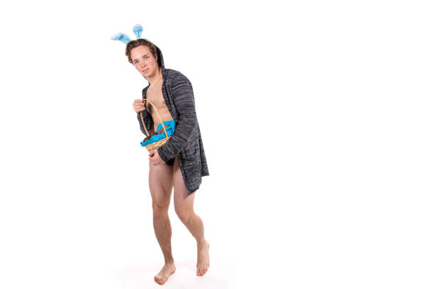 istock Easter. Funny attractive guy in a rabbit costume. 1305590905
