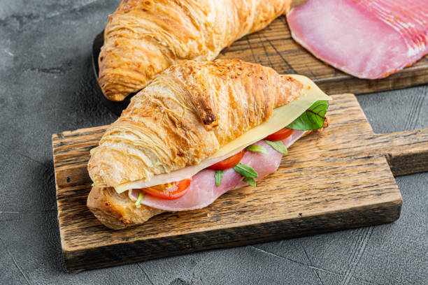 istock Croissant with ham, on gray stone background 1305591710