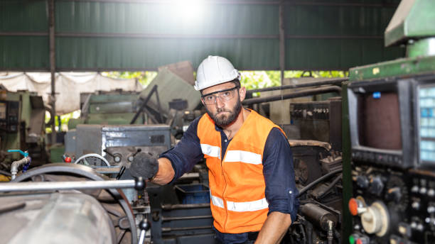 istock Male mechanical engineer, supervisor or factory worker with hardhat in system operation 1305591928