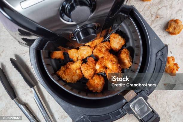 Air Frying Homemade Chicken Nuggets Stock Photo - Download Image Now - Air Fryer, Chicken Meat, Cooking