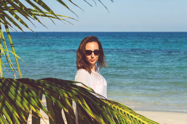 istock Young woman on beach 1305600681