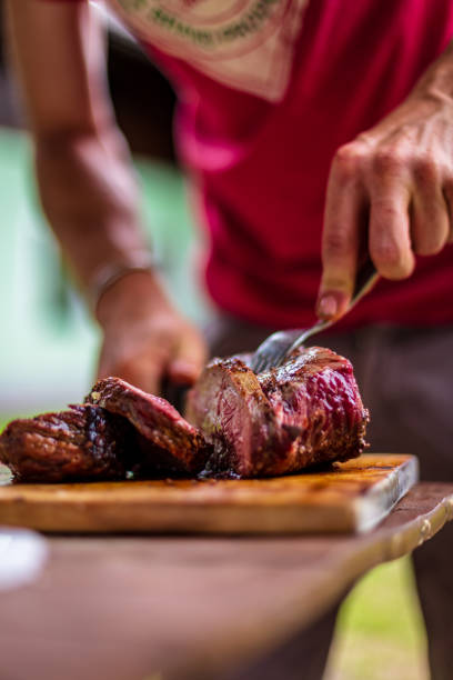 istock barbeque meat preparation in a summer day 1305607093