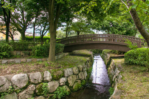 Narrow waterway and bridge in the park This picture taken at a public park in Omi Sakamoto, Otsu City otsu city stock pictures, royalty-free photos & images