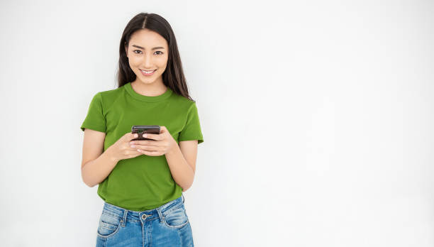portrait of beautiful asian japanese trendy business girl celebrate with smart phone with copy space on white background. success and happy woman education internet technology startup business. - japanese ethnicity women asian and indian ethnicities smiling imagens e fotografias de stock