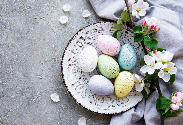 istock Colorful Easter eggs with spring blossom flowers 1305610808