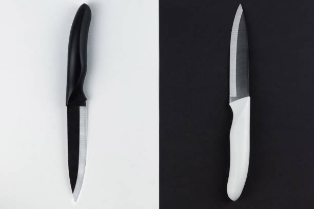 istock two table knives in black and white 1305610844