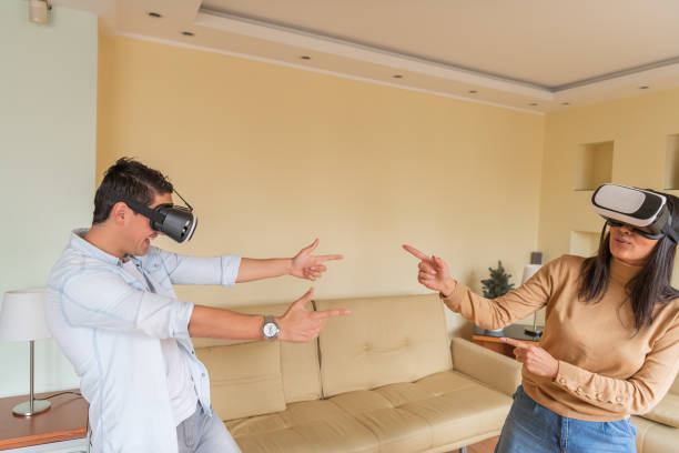 istock Young Man and his Girlfriend are Having Fun with VR Glasses. The Future has Arrived. 1305613078