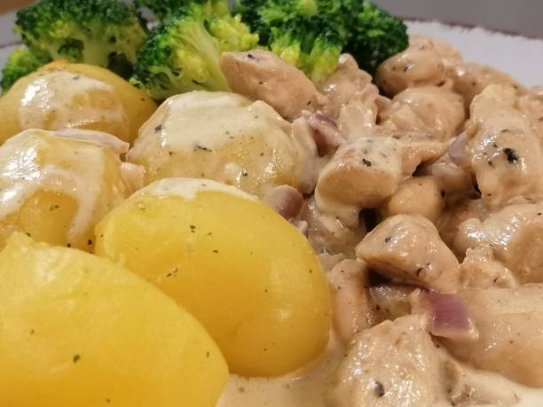 istock Potatoes with meat and cream sauce and broccoli 1305613213