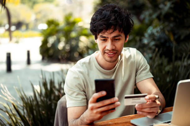 istock Man paying with his credit card 1305616014