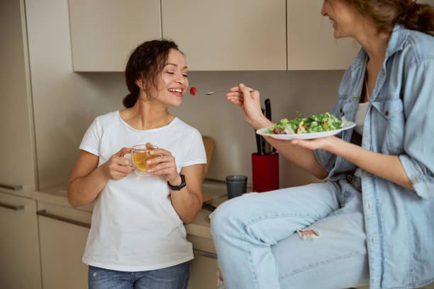 istock Positive delighted brunette going to eat tomato 1305616036