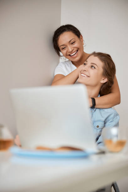 istock Positive delighted lesbians spending weekend at home 1305616109