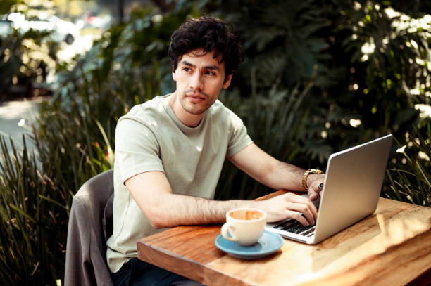 istock Businessman working from cafe 1305617002