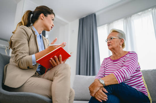 istock Senior woman talks with therapist 1305619523