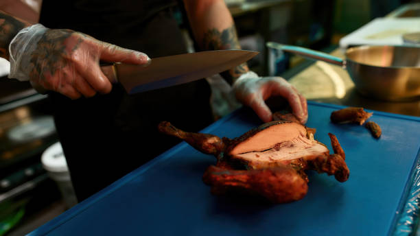 istock Chef with a knife working in an Asian kitchen 1305619923