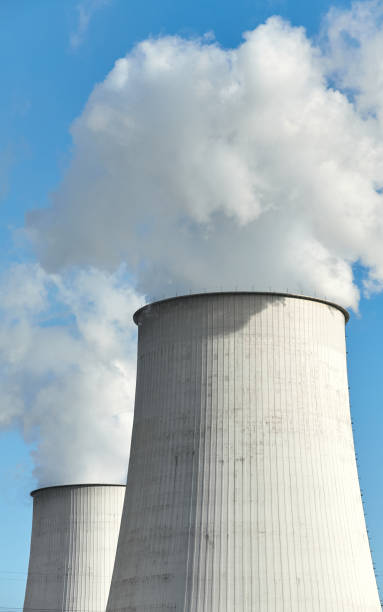 istock Smoking chimneys against the blue sky, environmental pollution concept. 1305621079