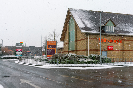 Sainsbury's in a snow shower. This is in Huntingdon, Cambridgeshire, UK.