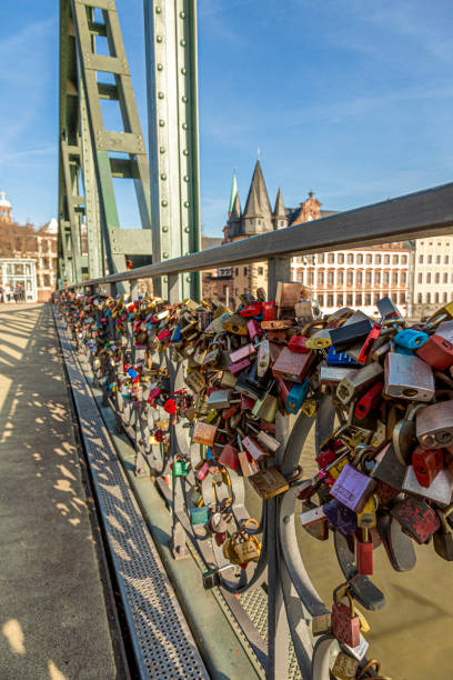 istock Love locks on pedestrian bridge Eiserner Steg in Frankfurt with skyline and Main river in background 1305627639