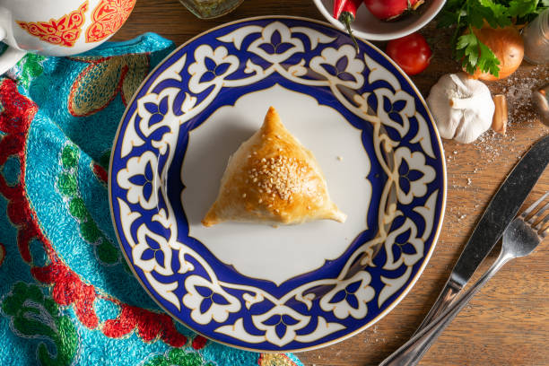 Samsa is an Uzbek dish made of dough stuffed with lamb, onion and spices