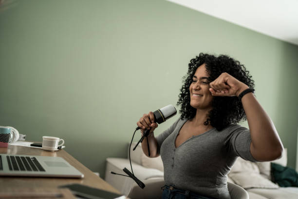 istock Woman doing podcast or vlogging at home 1305630470