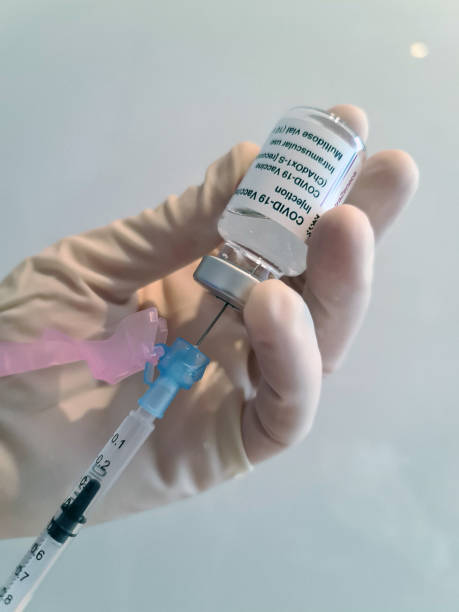istock Medical personal preparing Covid-19 Vaccine for its use 1305631299