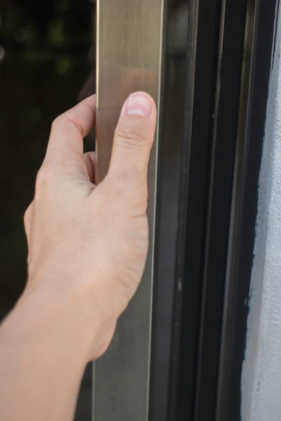 istock Hand on handle door for open to entering restaurant 1305631495