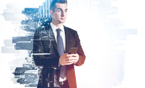 istock Serious young businessman using smartphone in city 1305632640